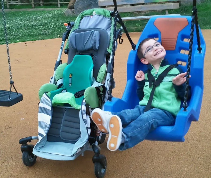 A young client enjoying time outdoors with support